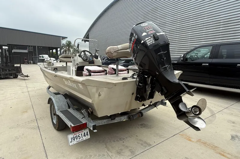 Slide: The Image of 2008 SeaArk 1652 MV boat on trailer with Suzuki outboard motor. - 4