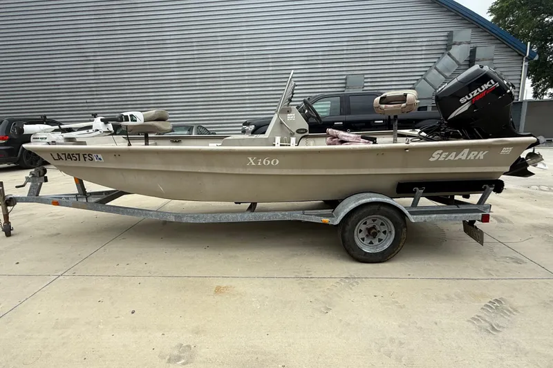 Slide: The Image of 2008 SeaArk 1652 MV boat on trailer with Suzuki outboard motor. - 5