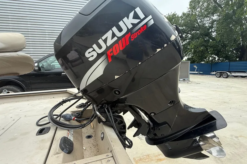 Slide: The Image of 2008 SeaArk 1652 MV boat with Suzuki Four Stroke outboard motor in a parking area. - 9