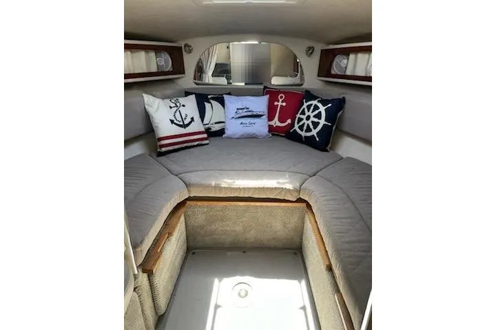 Slide: The Image of Interior of 2008 Sea Ray Sundancer 280 with nautical-themed cushions. - 13