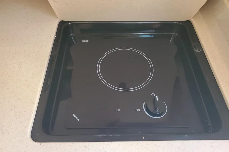 Slide: The Image of Built-in stovetop on 2008 Sea Ray Sundancer 280 yacht, featuring a sleek black design. - 18