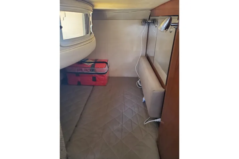 Slide: The Image of 2008 Sea Ray Sundancer 280 cabin interior with life jackets and lighting. - 22