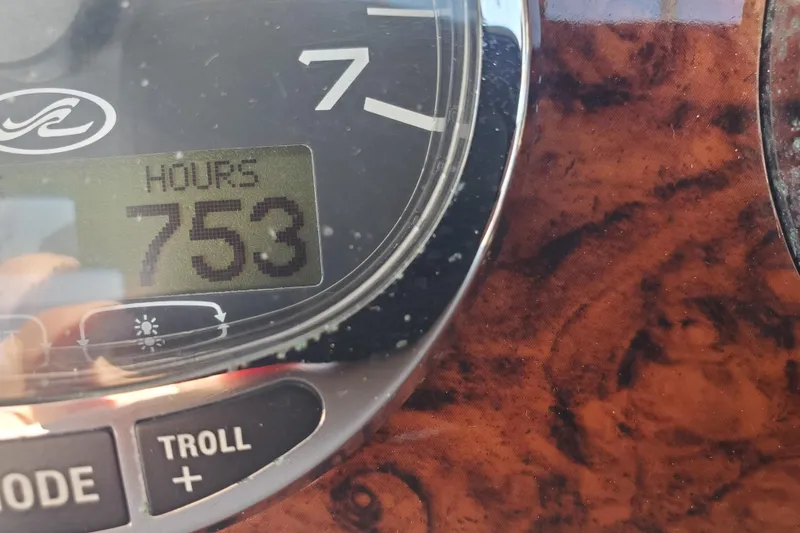 Slide: The Image of Close-up of Sea Ray Sundancer 280 dashboard showing 753 engine hours. - 24