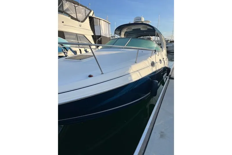 Slide: The Image of 2008 Sea Ray Sundancer 280 docked at marina, side view. - 3