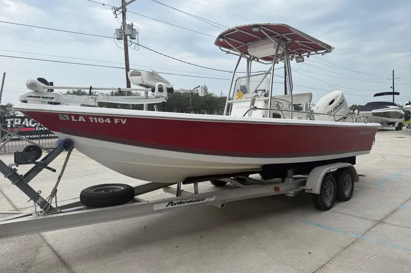 Slide: The Image of 2005 Sea Pro SV2100CC Bay Boat on trailer, red hull, Suzuki outboard motor. - 6