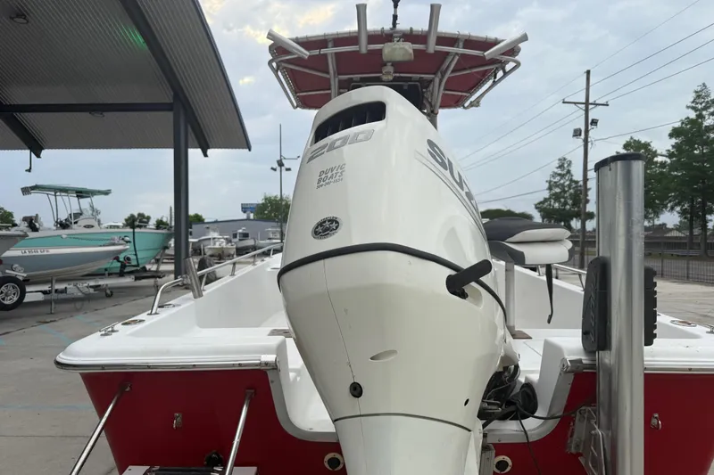 Slide: The Image of 2005 Sea Pro SV2100CC Bay Boat with Suzuki outboard motor, docked at marina. - 8