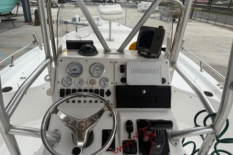Slide: The Image of 2005 Sea Pro SV2100CC Bay Boat dashboard with steering wheel and navigation equipment. - 9