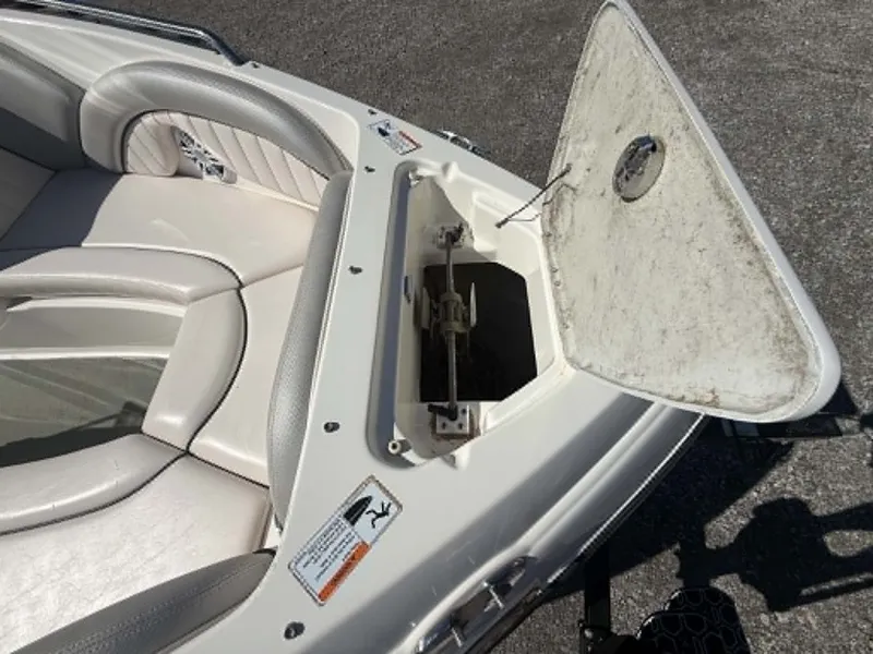 Slide: The Image of 2009 Yamaha SX 230 High Output boat with open storage compartment. - 2