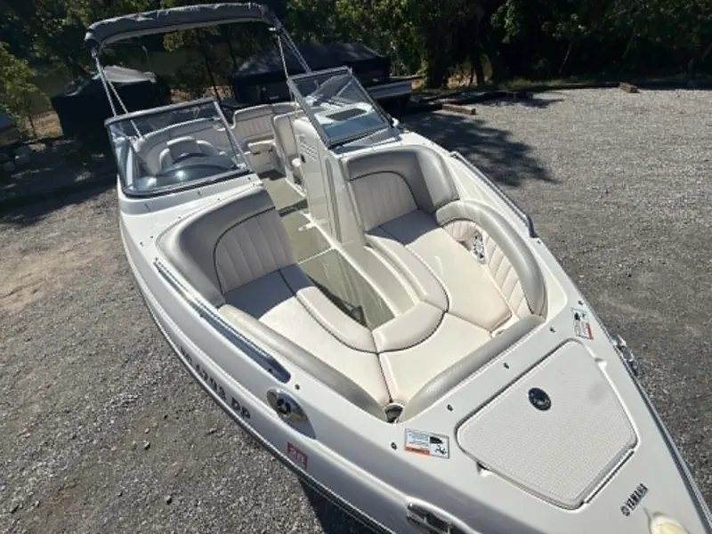 Slide: The Image of 2009 Yamaha SX 230 High Output boat parked on gravel surface. - 21