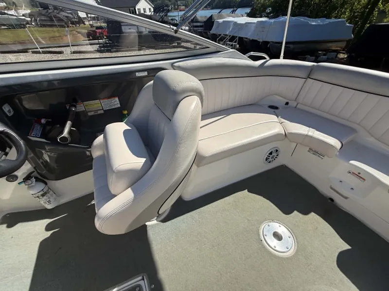 Slide: The Image of Interior of a 2009 Yamaha SX 230 High Output boat with gray seating. - 23