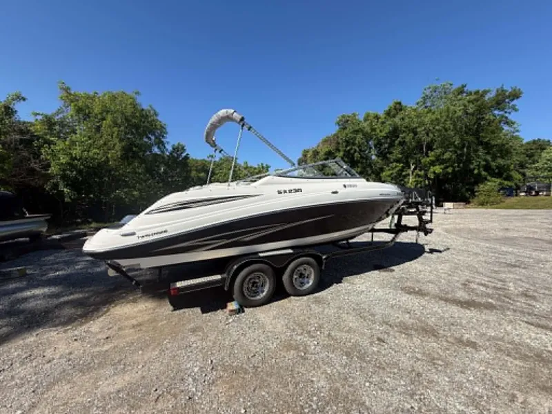 Slide: The Image of 2009 Yamaha SX 230 High Output boat on trailer outdoors. - 27