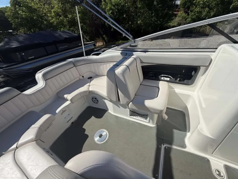 Slide: The Image of Interior of a 2009 Yamaha SX 230 High Output boat with gray seating. - 31