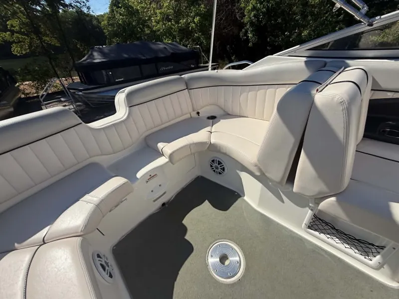Slide: The Image of Interior of a 2009 Yamaha SX 230 High Output boat with white seating. - 35