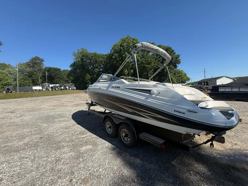 Slide: The Image of 2009 Yamaha SX 230 High Output boat on trailer outdoors. - 4