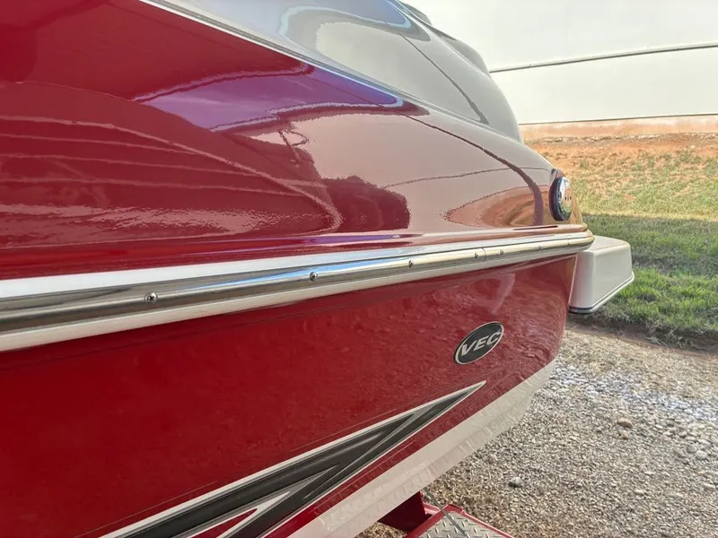 Slide: The Image of Red Glastron GX 205 boat hull, 2008 model, featuring VEC logo. - 11