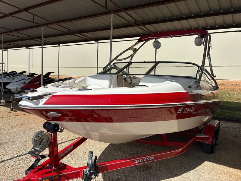 Slide: The Image of 2008 Glastron GX 205 boat in red and white on trailer. - 3
