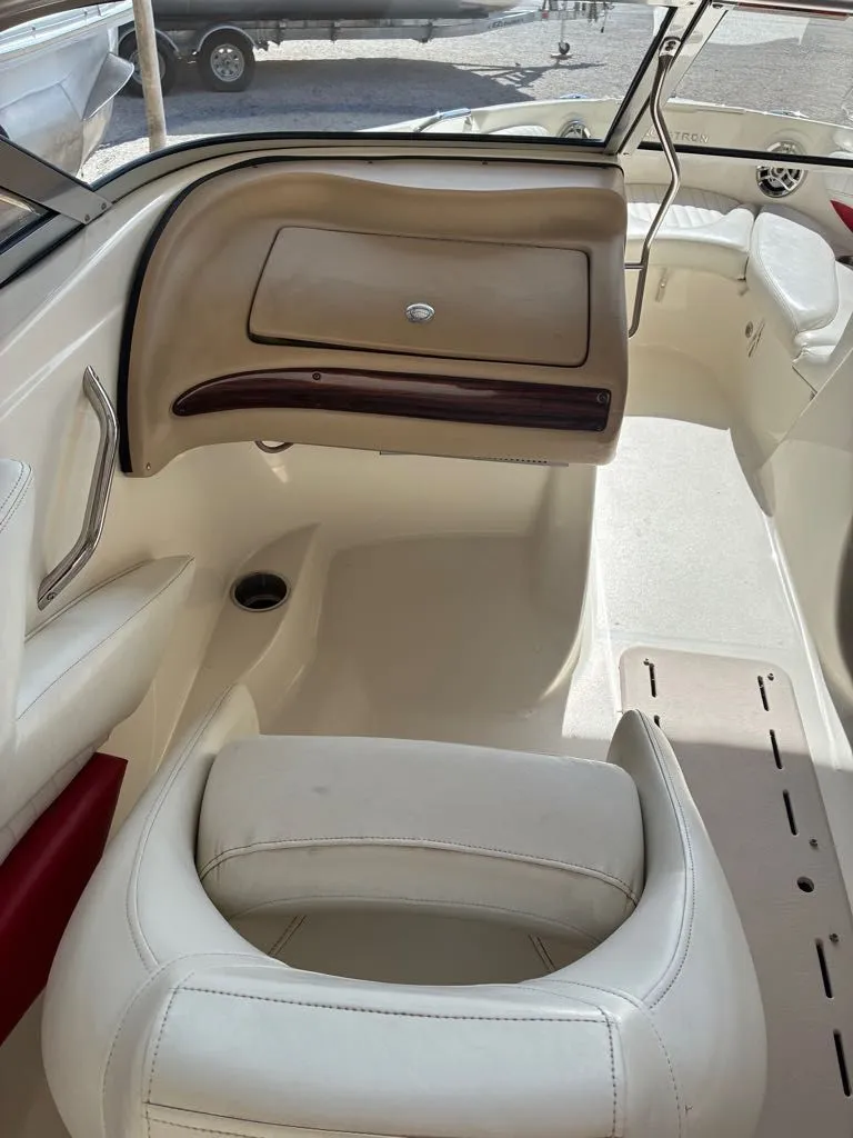 Slide: The Image of Interior of a 2008 Glastron GX 205 boat with beige and white seating. - 4