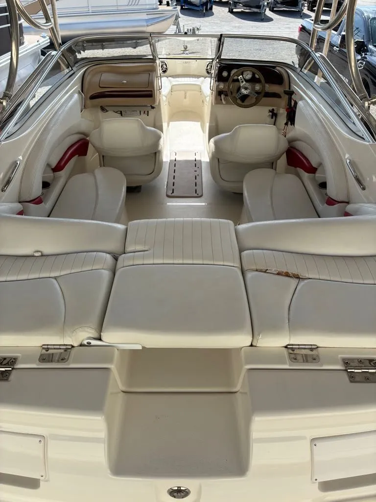 Slide: The Image of Interior of a 2008 Glastron GX 205 boat with white seating. - 5