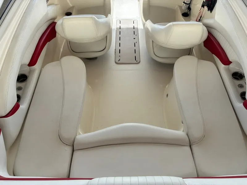 Slide: The Image of Interior of a 2008 Glastron GX 205 boat with white seating. - 6