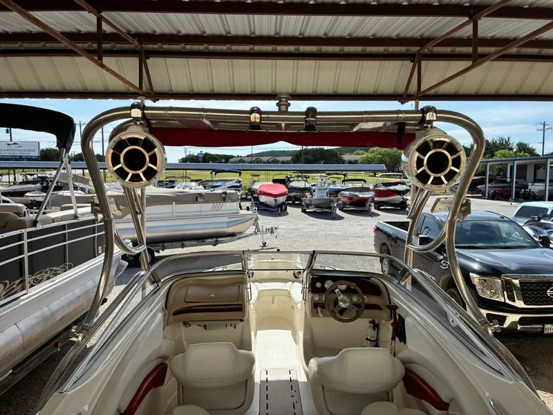 Slide: The Image of Interior view of a 2008 Glastron GX 205 boat at the marina. - 9