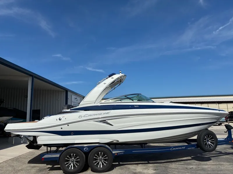The Image of 2026 Crownline 278 SS boat on trailer under sunny skies. - 1