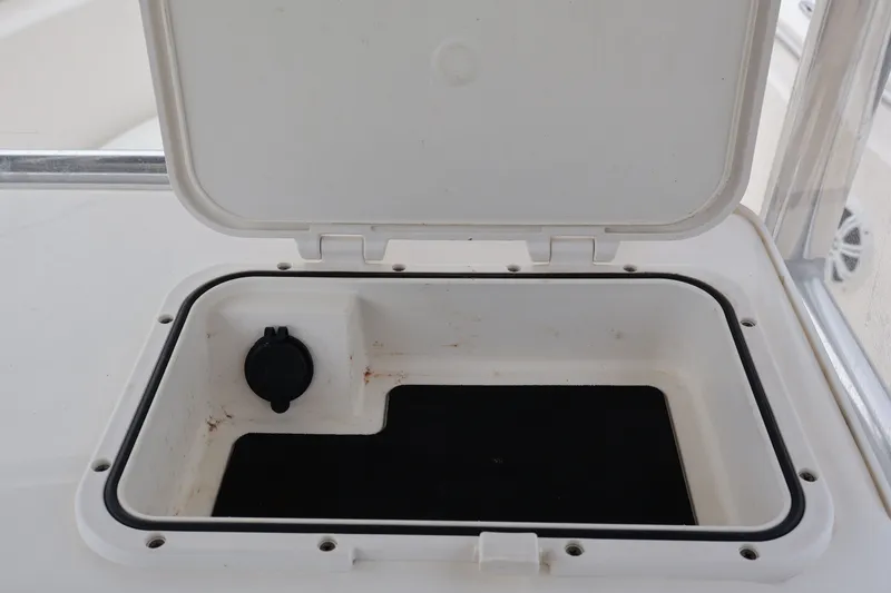 Slide: The Image of Open storage compartment on a 2020 Bulls Bay 230CC boat. - 13