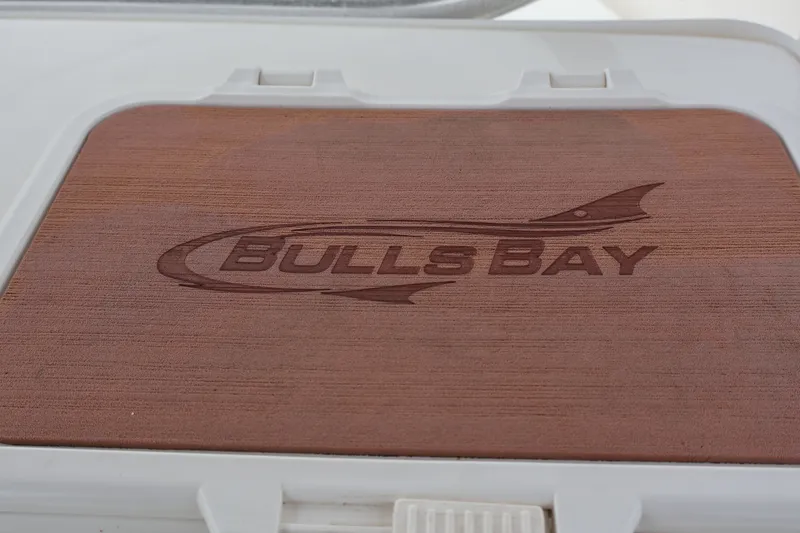 Slide: The Image of Bulls Bay 230CC 2020 logo on wooden panel. - 16
