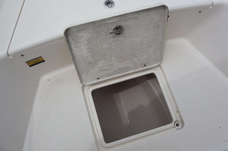 Slide: The Image of Open storage compartment on a 2020 Bulls Bay 230CC boat. - 19