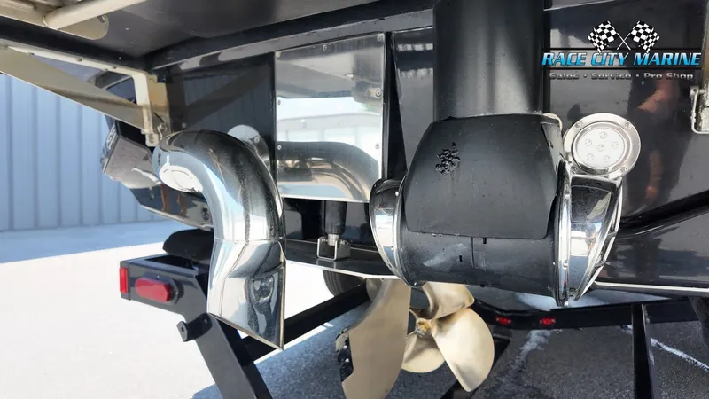 Slide: The Image of Close-up of a 2015 Nautique G23's stern with propeller and exhaust. - 10