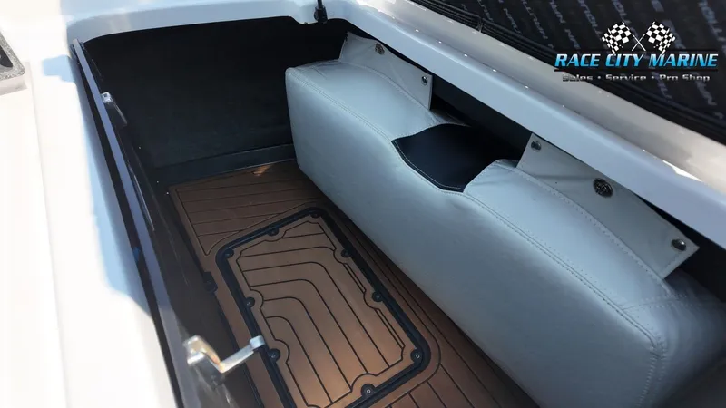 Slide: The Image of A boat storage area with cushioned seating and wooden flooring. - 17