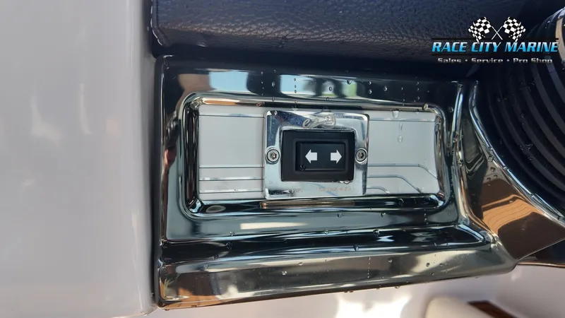 Slide: The Image of Close-up of a switch on a boat, surrounded by chrome. "Race City Marine" logo visible. - 26