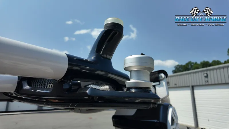 Slide: The Image of Close-up of a boat detail with a modern, black design and a silver fastening element. - 46