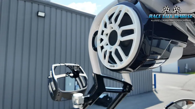 Slide: The Image of Close-up of a speaker and wakeboard holder on a Nautique G23 boat. - 29