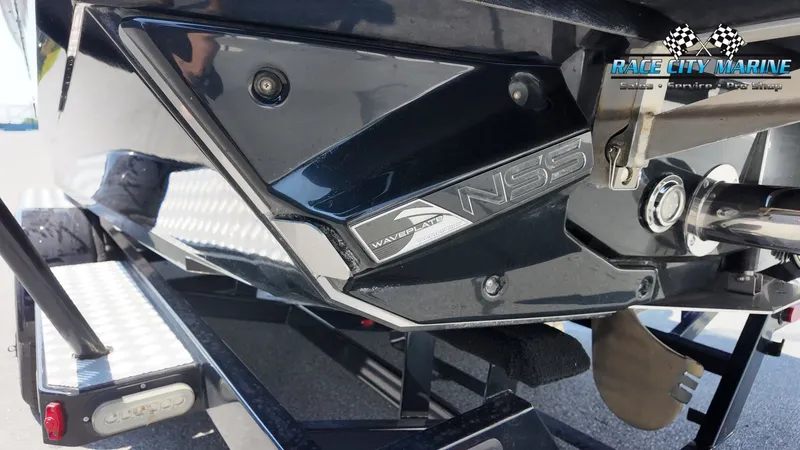 Slide: The Image of Close-up of a 2015 Nautique G23's stern with wave shaping system. - 45