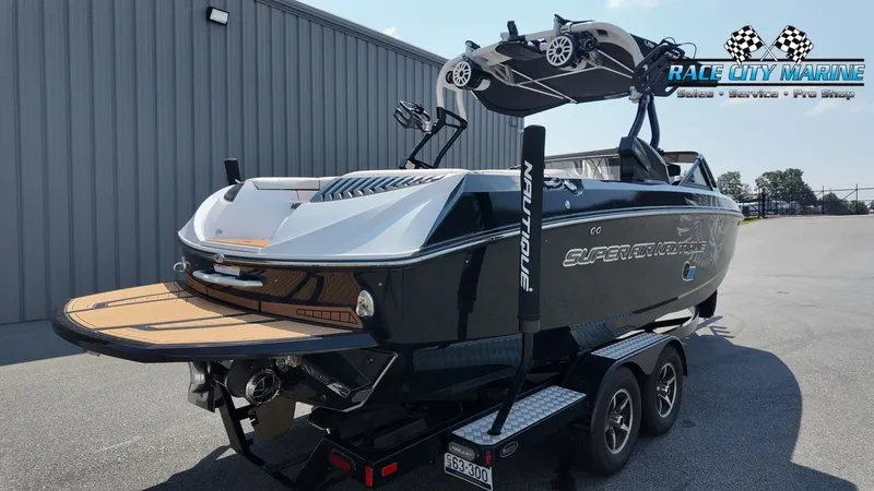 Slide: The Image of A 2015 Nautique G23 boat on a trailer, ready for transport. - 8