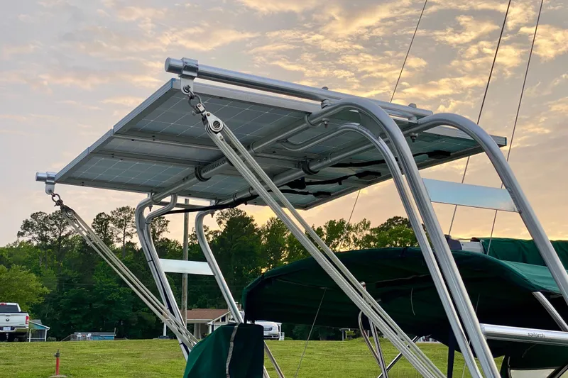 Slide: The Image of Solar panel installation on 1992 Island Packet 29 sailboat at sunset. - 12