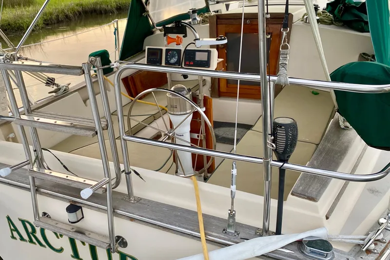 Slide: The Image of Cockpit of 1992 Island Packet 29 sailboat with navigation instruments and seating. - 13