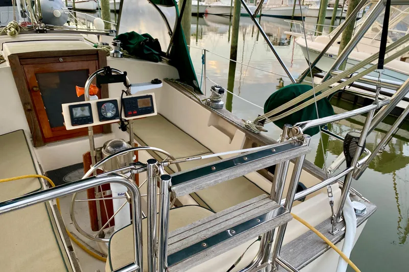 Slide: The Image of Cockpit of a 1992 Island Packet 29 sailboat with navigation instruments and seating. - 14