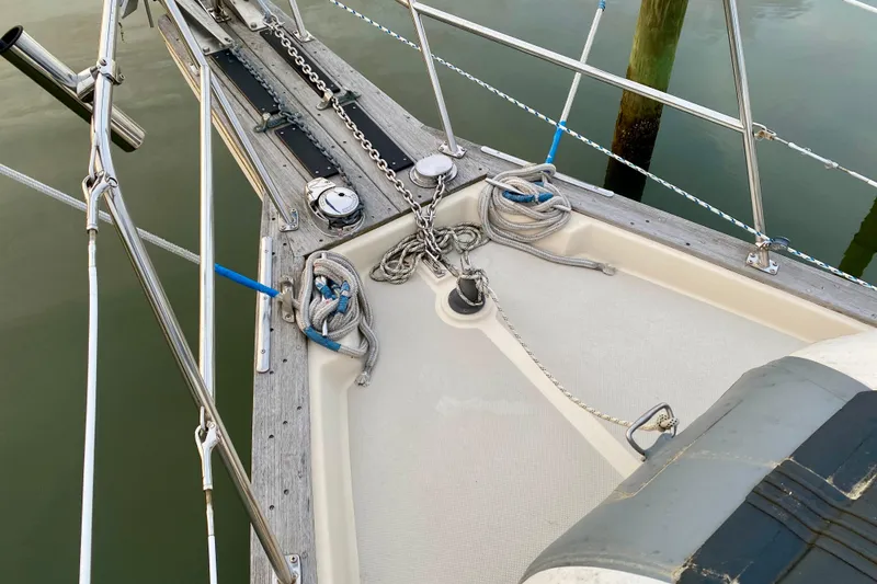 Slide: The Image of Bow of 1992 Island Packet 29 sailboat with ropes and anchor chain. - 26