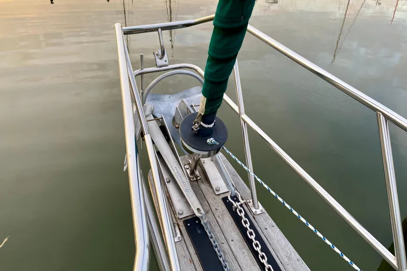 Slide: The Image of Bow of 1992 Island Packet 29 sailboat with anchor and railing. - 27