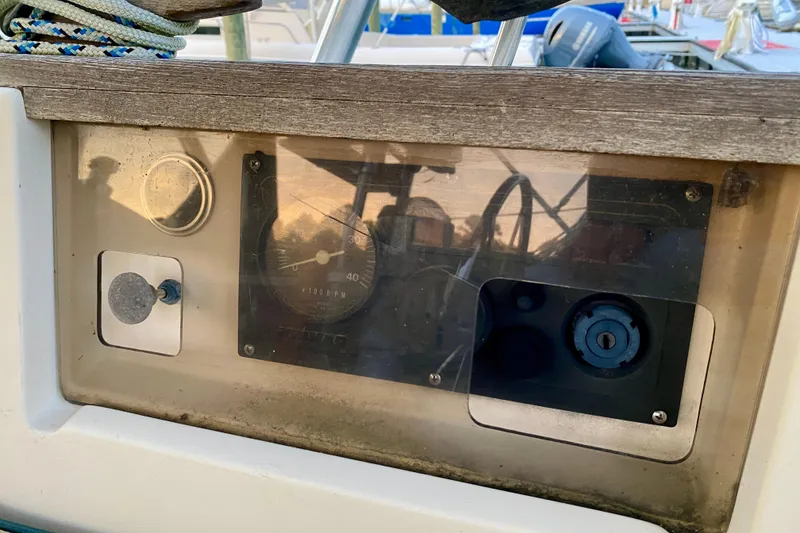 Slide: The Image of Control panel of a 1992 Island Packet 29 sailboat with gauges and switches. - 39