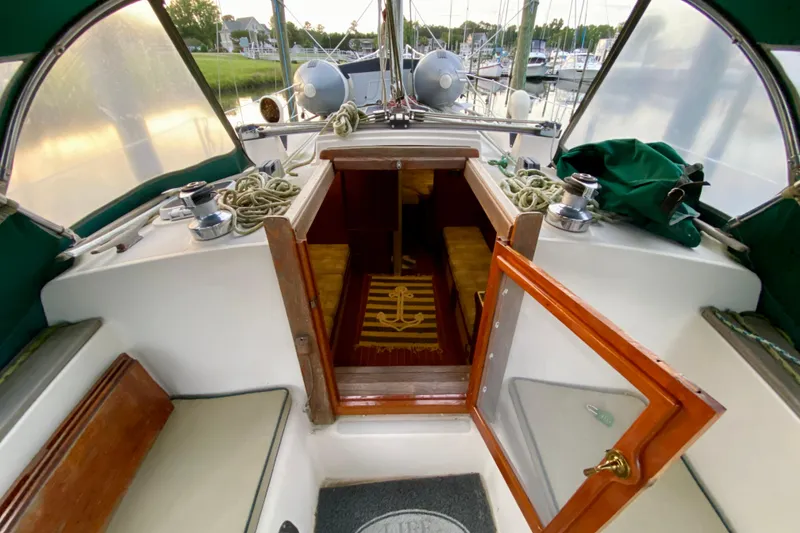 Slide: The Image of Interior view of a 1992 Island Packet 29 sailboat with open cabin door. - 40