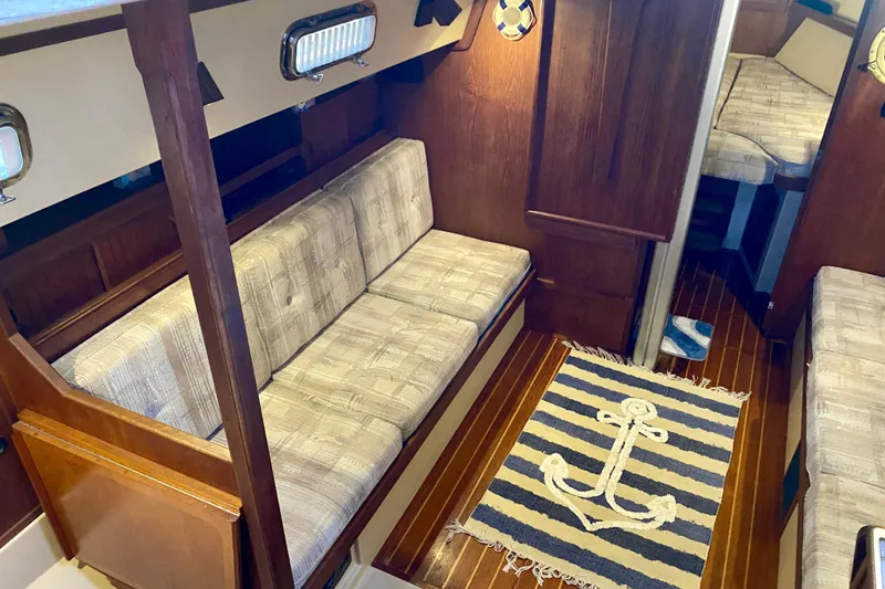 Slide: The Image of Interior of 1992 Island Packet 29 sailboat with cozy seating and nautical decor. - 43