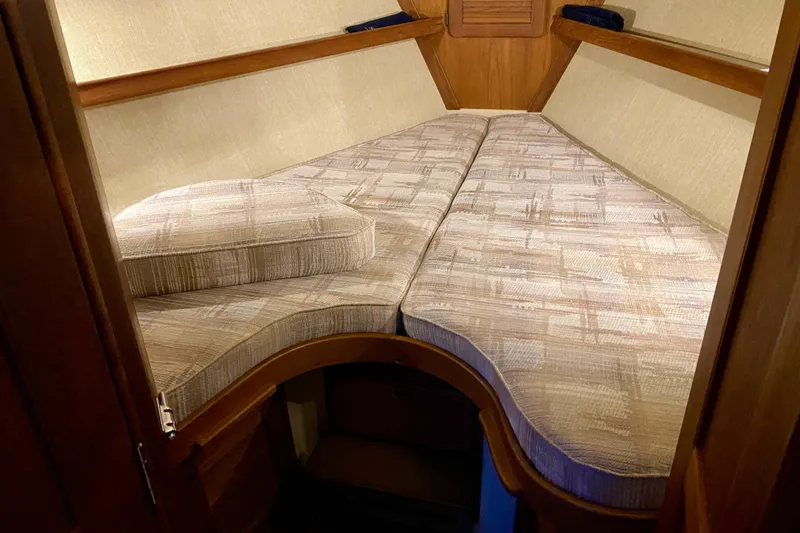 Slide: The Image of Interior cabin of a 1992 Island Packet 29 sailboat with cushioned V-berth. - 69