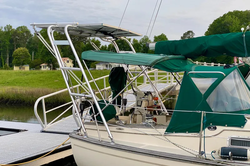 Slide: The Image of Sailboat Island Packet 29, 1992 model, docked with green canopy and solar panel. - 8