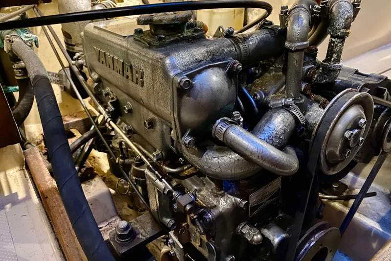 Slide: The Image of Engine of a 1992 Island Packet 29 sailboat, featuring a Yanmar diesel engine. - 89