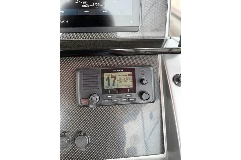Slide: The Image of Garmin marine radio on 2022 Fountain 34 SC boat dashboard. - 11