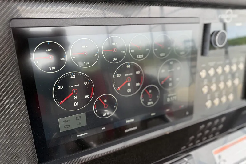 Slide: The Image of Dashboard of 2022 Fountain 34 SC boat with digital gauges and controls. - 13
