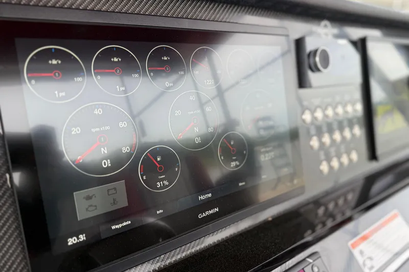 Slide: The Image of Dashboard of 2022 Fountain 34 SC boat with digital gauges and controls. - 14
