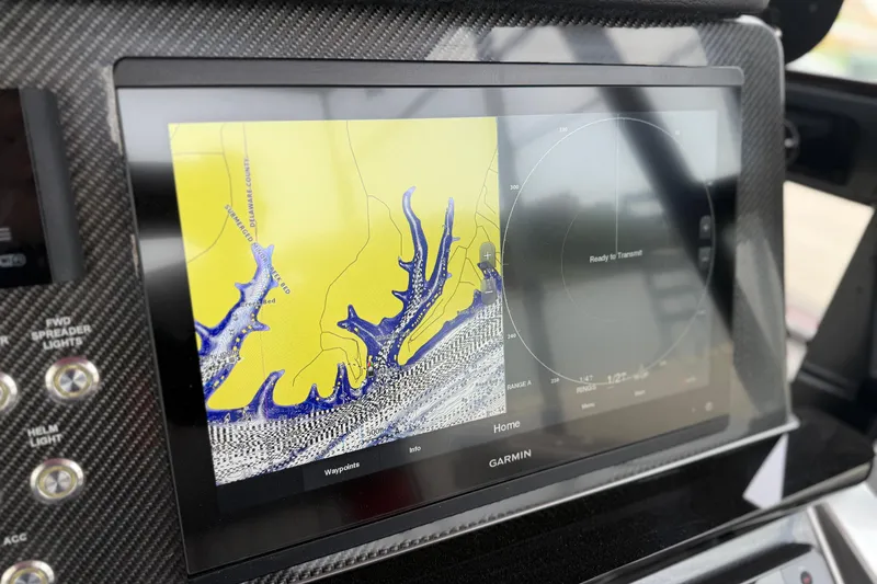 Slide: The Image of Garmin navigation display on 2022 Fountain 34 SC boat dashboard. - 15